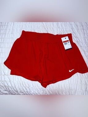 Nike Women’s Red Athletic Shorts with White Swoosh